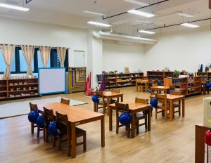 Montessori Classroom with children engaged in hands-on learning activities in a prepared, child-centered environment.