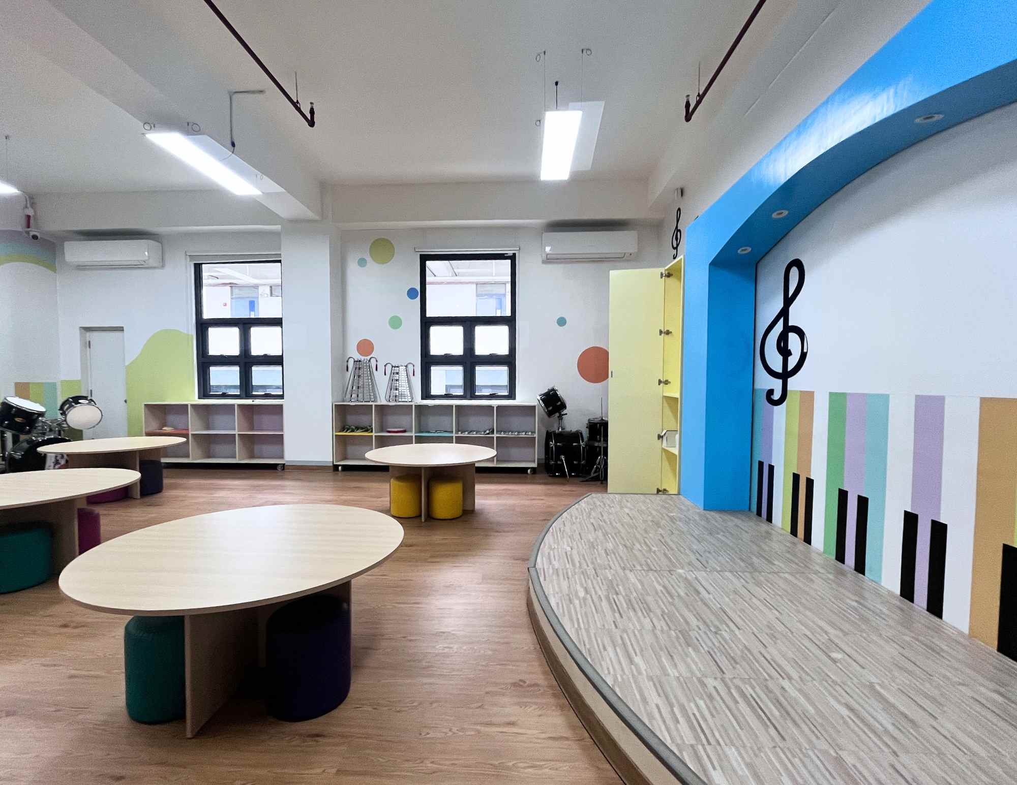 A well-equipped music room featuring instruments, sound equipment, and a comfortable space for practice and creativity.
