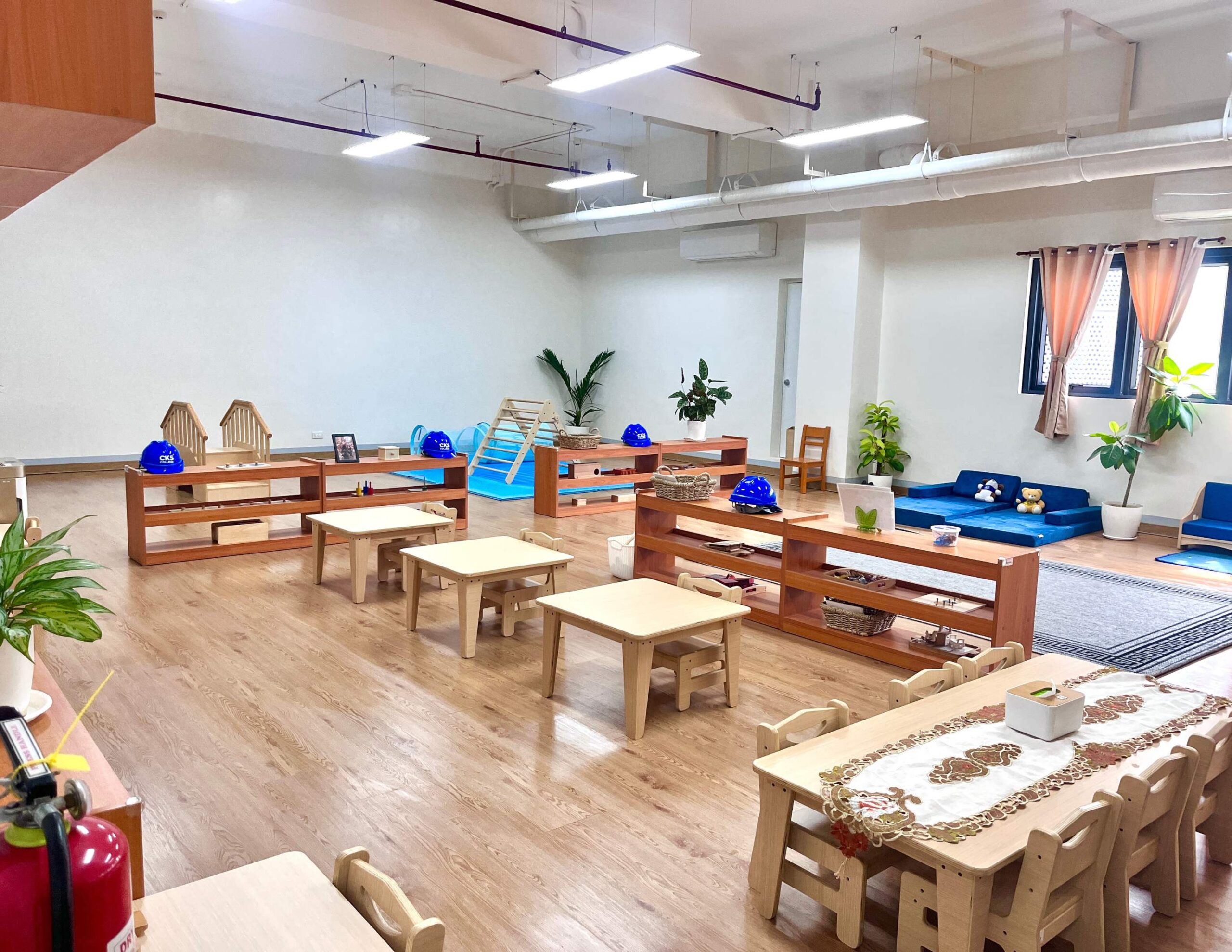 Montessori Classroom with children engaged in hands-on learning activities in a prepared, child-centered environment.